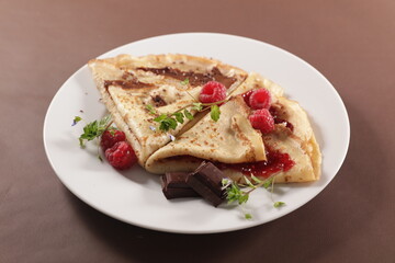 crepe with chocolate and raspberry jam
