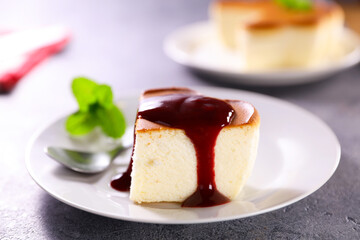 cheesecake and slice with berry fruit syrup