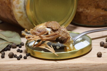 Preserved stewed meat on wooden table