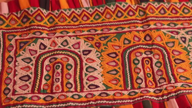 bharatkam or embroidery handicrafts,ahir tribe traditional and multi colors homemade embroidery arts close up, embroidery background and texture beautiful view,