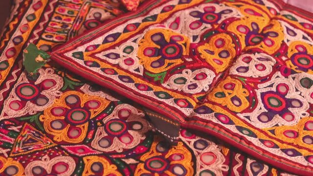 art embroidery,decorations kutch art,beautiful view of embroidery,colorful ahir bharat,embroidered handicrafts close-up,selective focus,rajasthan embroidery flower and pattern art