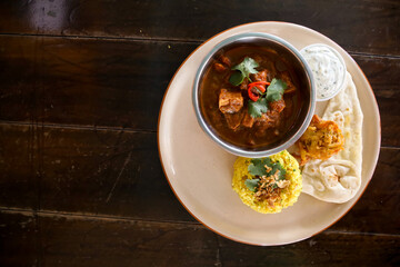 Rogan Josh Indian Curry with Pilaf rice and Naan bread