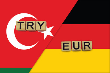 Turkey and Germany currencies codes on national flags background