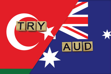 Fototapeta na wymiar Turkey and Australia currencies codes on national flags background