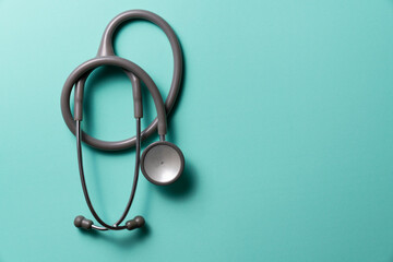 Top view of stethoscope on the green background, schedule to check up healthy concept