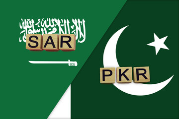 Saudi Arabia and Pakistan currencies codes on national flags background