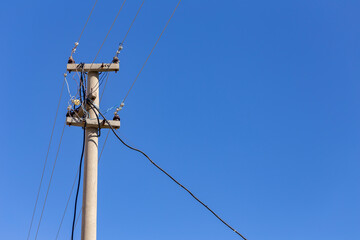 Old electricity pole and blue sky in Turkey.