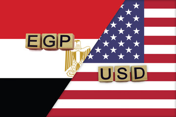 Egypt and USA currencies codes on national flags background