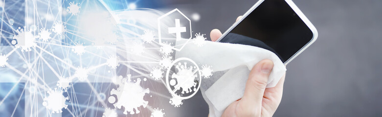 Сleaning concept. Wipe dirt off surfaces. Disinfectant treatment of phone screenl. Sanitary treatment at home quarantine.