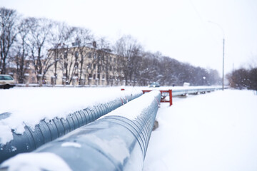 Gas pipe transite snow winter. Winter landscape with the snow-covered gas pipeline and trees in...