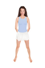Full length portrait of an attractive brunette woman wearing a white skirt over a blue bathing suit, studio photo isolated in front of white background