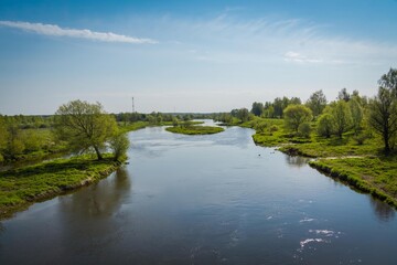 Fototapeta na wymiar Rural river and blue sky