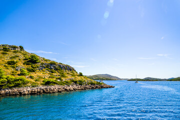 Obraz premium Adriatic coast of island with green plants, Mediterranean Sea, Croatia, Dalmatia