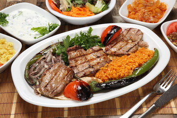 Grilled lamb boneless cutlet served grilled tomato and pepper