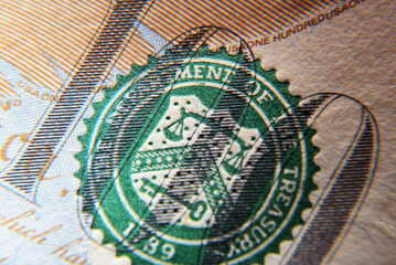 Dolar USA close up. Macro texture of a fragment of the dollar bill. USD banknote texture. One hundred American dollars macro.