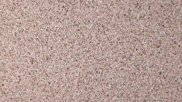  Spinning light colored pin cushion cork texture background .