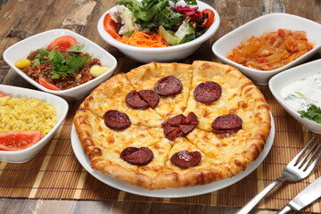 turkish pitta with cheddar and turkish pepperoni