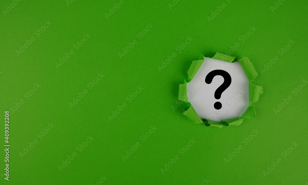 Aufkleber green torn paper with copy space and question mark on white background. question mark concept