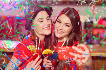 Confetti party. Two young girls lesbians at a party in the club take a selfie