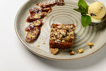 Churchkhela served on a ceramic plate over white background. Traditional Georgian dessert.