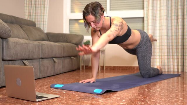 Woman Doing Lower Back During Online Class At Home