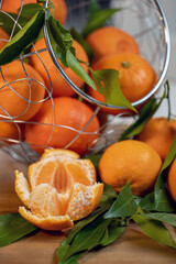 tangerines with leaves on a texture bag