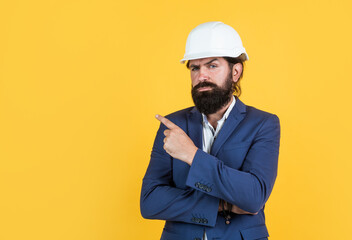 Man pointing finger on copy space in hard hat, Supervisor Foreman Manager in construction