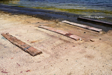 boards on the beach on the way to the water