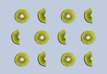 Fototapeta premium Kiwi isolated on blue background. Half of kiwi. Kiwi pattern. Food photography.