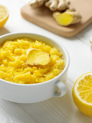 Natural home made remedy that will make immune system stronger and powerful with lemon and ginger with garlic vertical shot