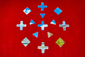 different shapes on a red background