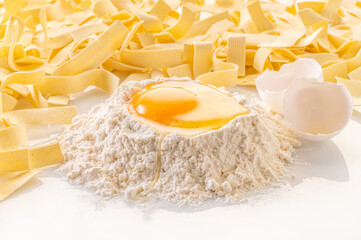 broken egg in flour and pasta
