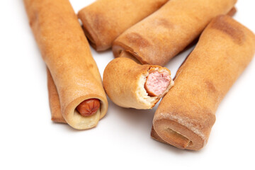 Sausages in dough isolated on white