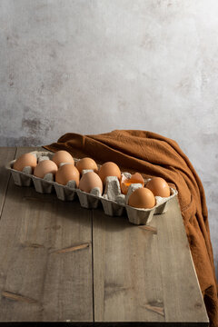 eggs in a basket on the wooden table