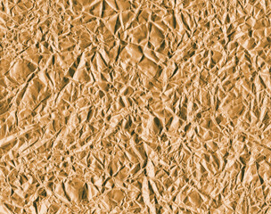 Crumpled gold foil texture background
