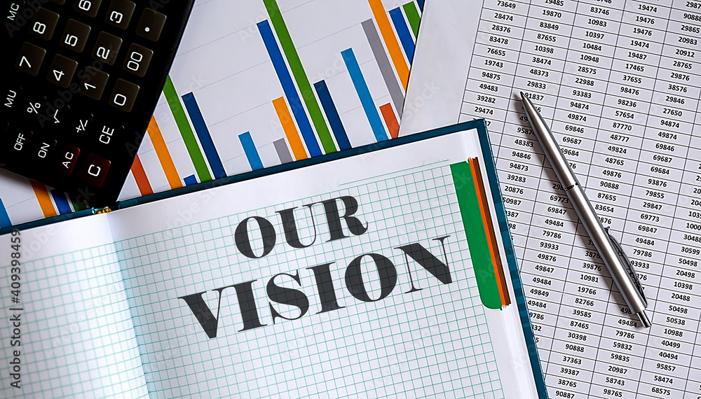 Poster closeup of notebook with text our vision on the chart background.