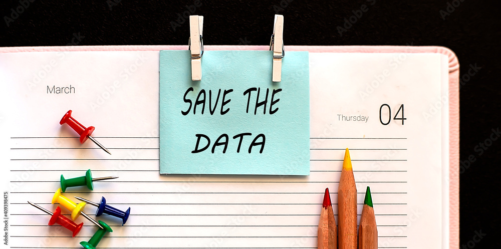 Poster text save the date on stickers on diary with office tools