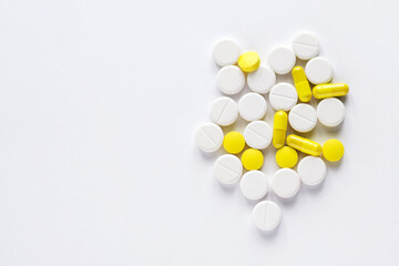 white pill smedicine macro - medical background, closeup of yellow, white pills
