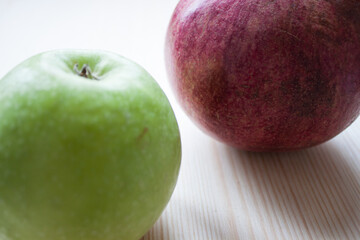Rosh Hashanah jewish New Year holiday concept. Creative layout of traditional symbols - apples, honey, pomegranate isolated on white, top view, copy space.