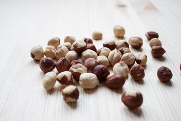 Creative layout made of hazelnut nuts on white background.Flat lay. Food concept.