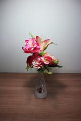 Pink flowers in vintage vase on wooden table, floor, gray cement wall Stylish stock image format for banner templates, text artwork, quotes, fonts, festivals