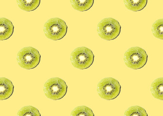 Kiwi isolated on yellow background. Half of kiwi. Kiwi pattern. Food photography.