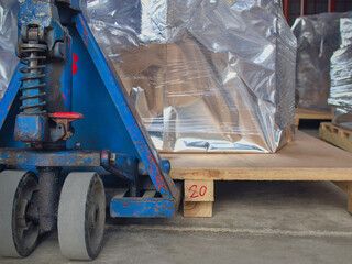 Packed goods on top of palette loaded in an isolated lift truck .