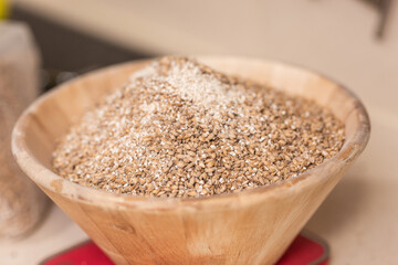 man weighs malt for brewing beer on scale