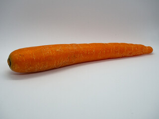 Single carrot horizontally isolated on a white background