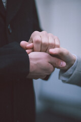 hands of the groom and the bride