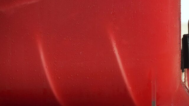 Ice strawberry fruit juice crush machine rotating inside, closeup detail