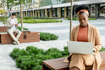 Woman working online outdoors