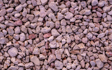 Stone background. blue gravel. Granite texture. The rocky road. Construction material. The texture of the stones. Wallpaper with fine gravel.