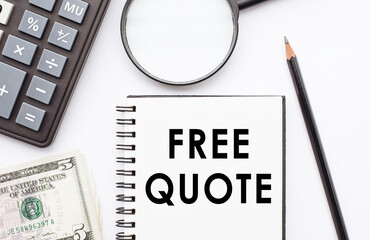 Notepad with FREE QUOTE note on desk with calculator, dollars and magnifier.